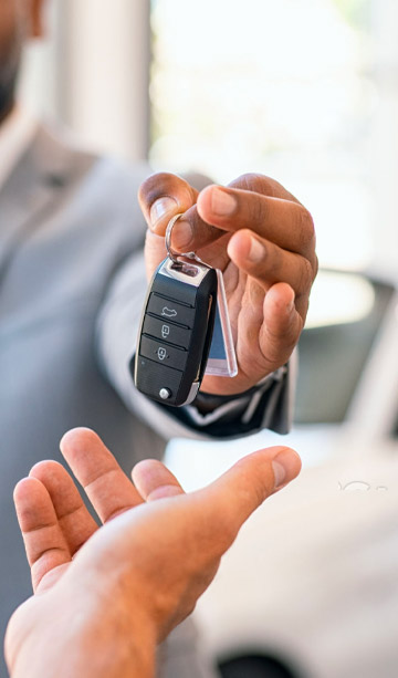 A person taking the keys to their new car