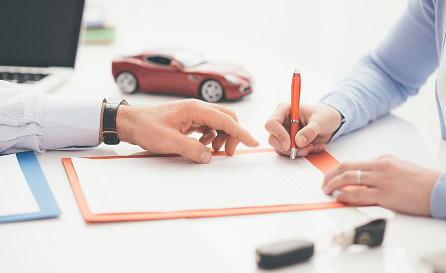 A person signing auto insurance